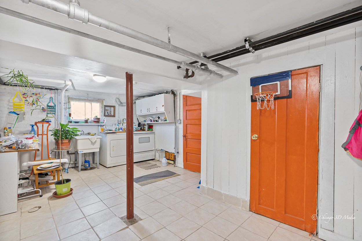 4954 West Byron Street Chicago, IL 60641 - Photo 29 of 42 a view of a hallway with dining table and chairs