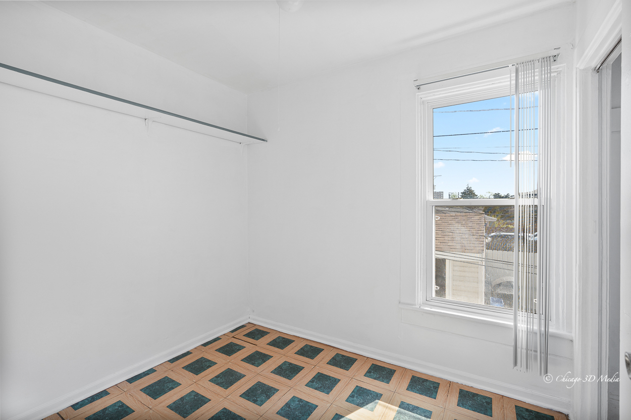 4954 West Byron Street Chicago, IL 60641 - Photo 33 of 42 a view of an empty room with a window