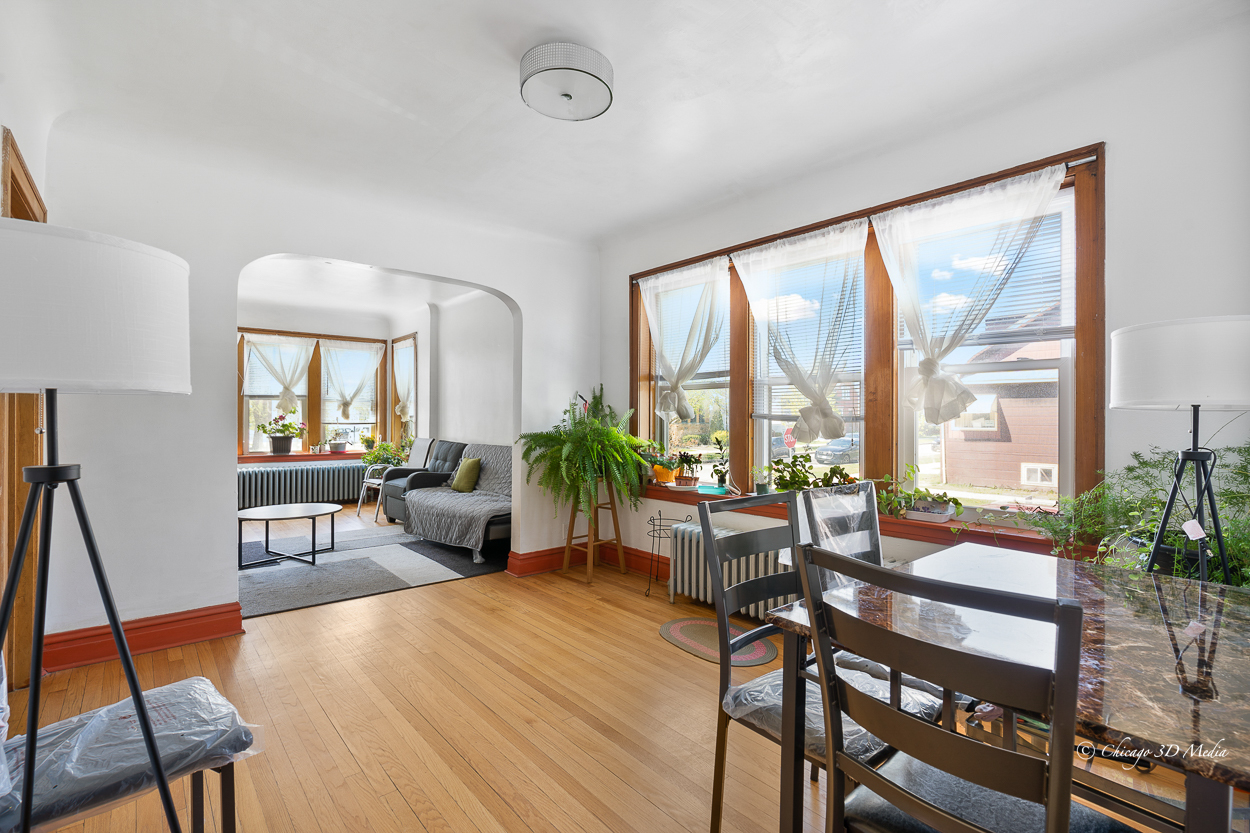 4954 West Byron Street Chicago, IL 60641 - Photo 8 of 42 a living room with furniture and a large window
