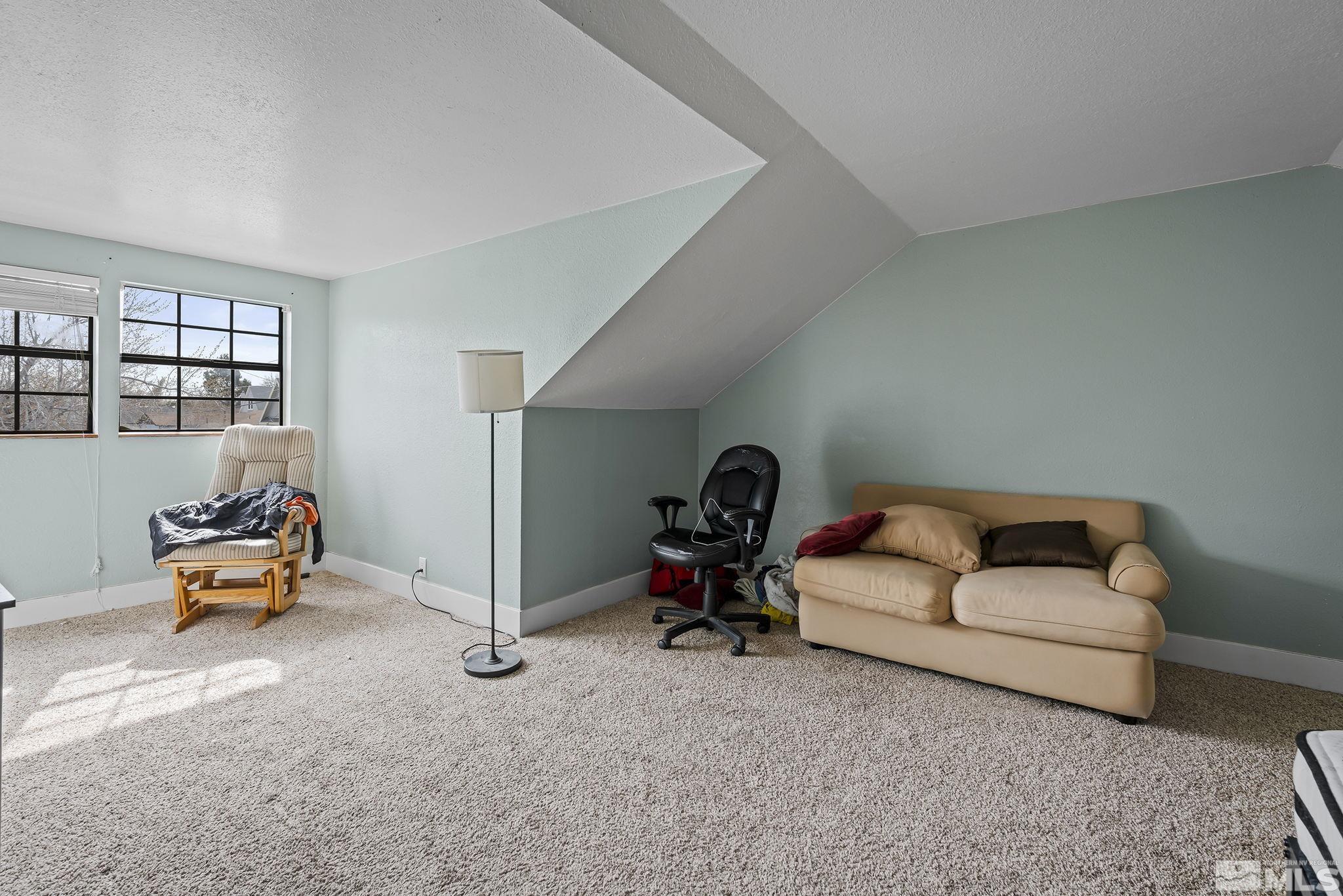 1001 Nevada Street Reno, NV 89503 - Photo 13 of 16 a bedroom with furniture and a couch