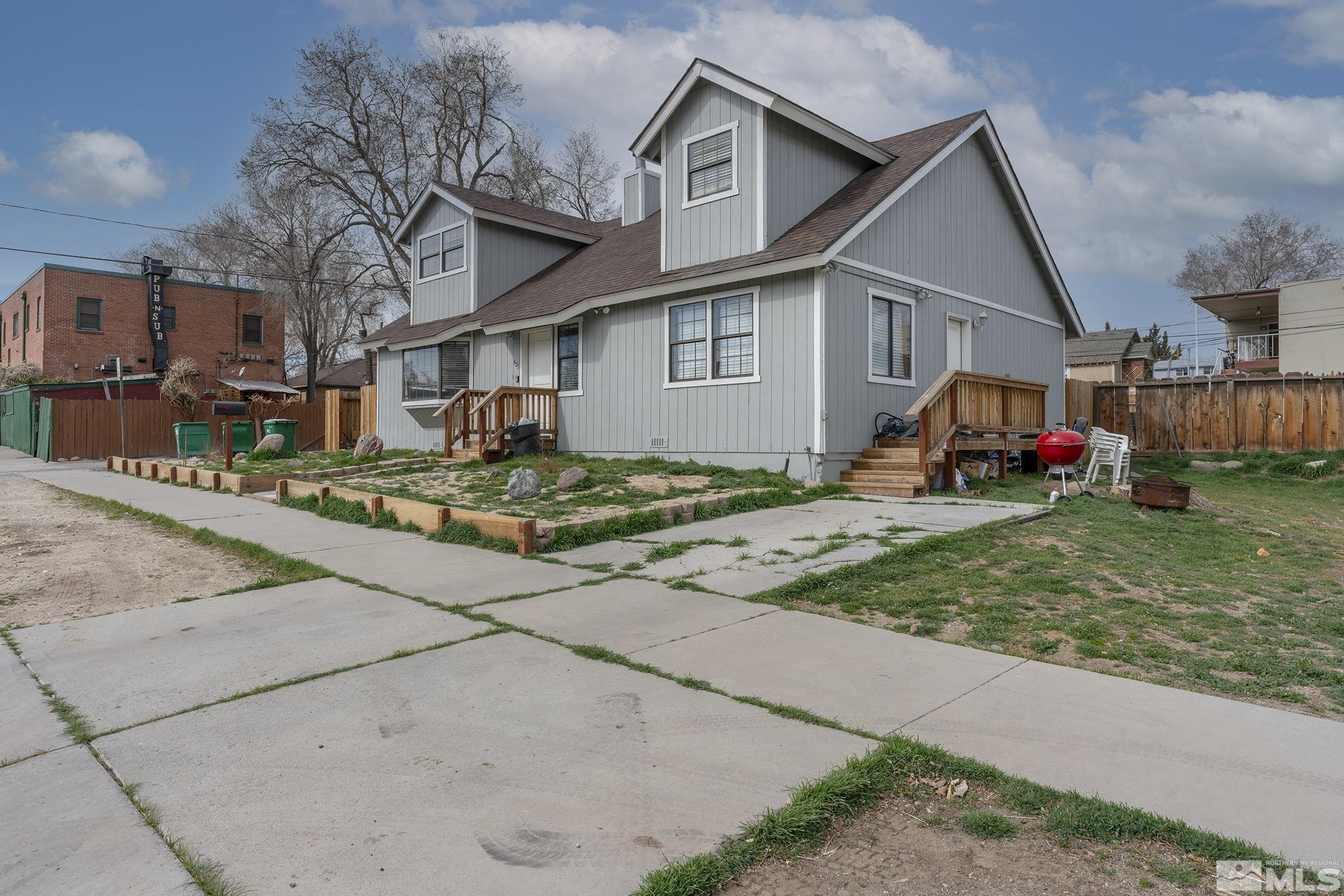 1001 Nevada Street Reno, NV 89503 - Photo 2 of 16 a front view of a house with a yard