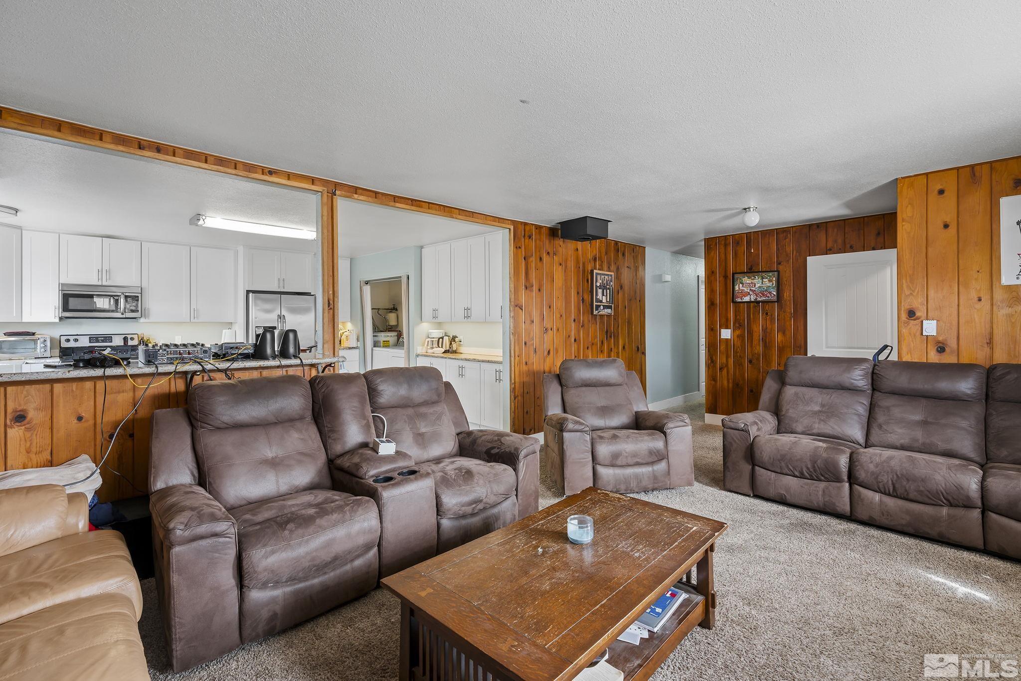 1001 Nevada Street Reno, NV 89503 - Photo 5 of 16 a living room with furniture and a large window