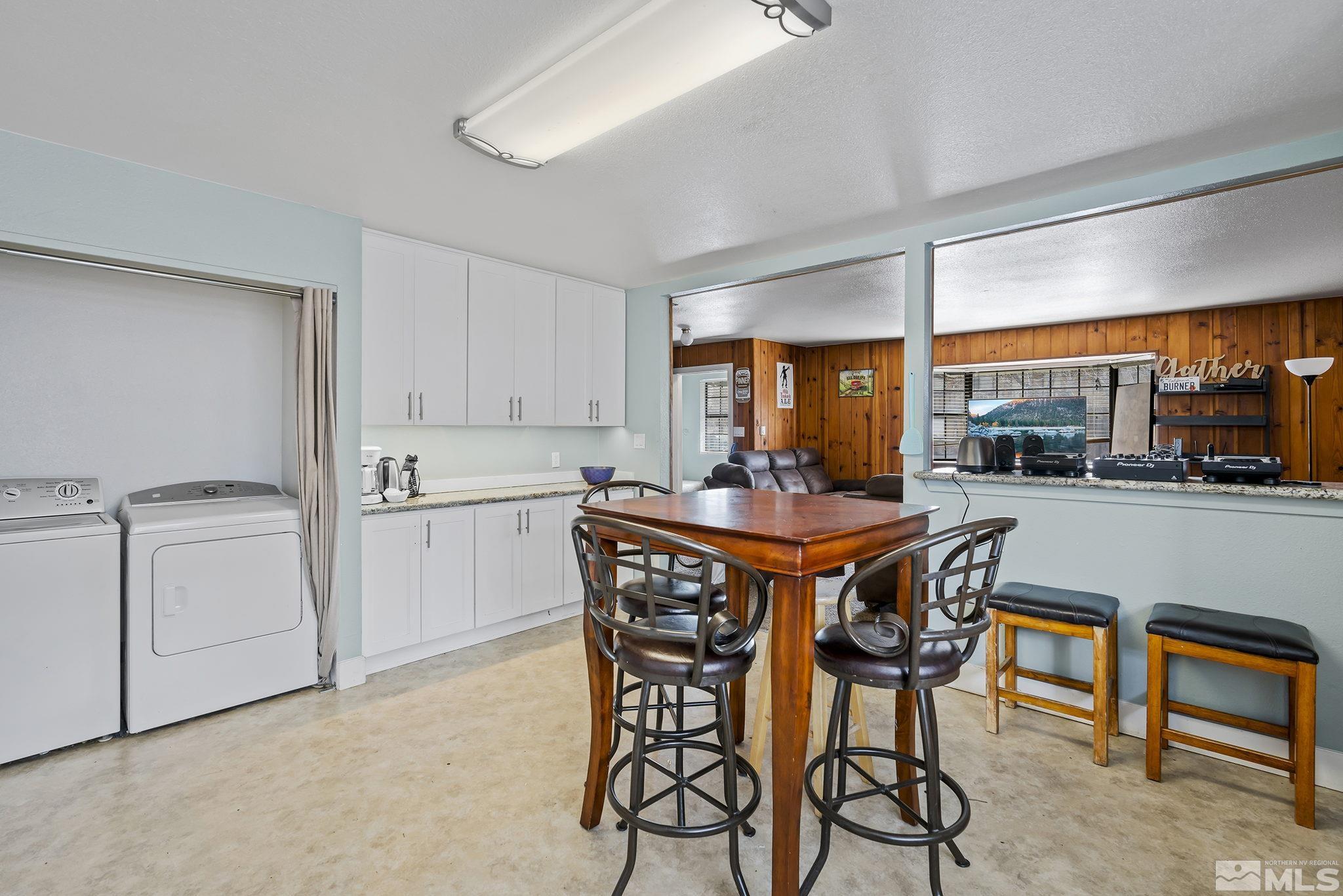 1001 Nevada Street Reno, NV 89503 - Photo 8 of 16 a dining room with furniture and a floor to ceiling window