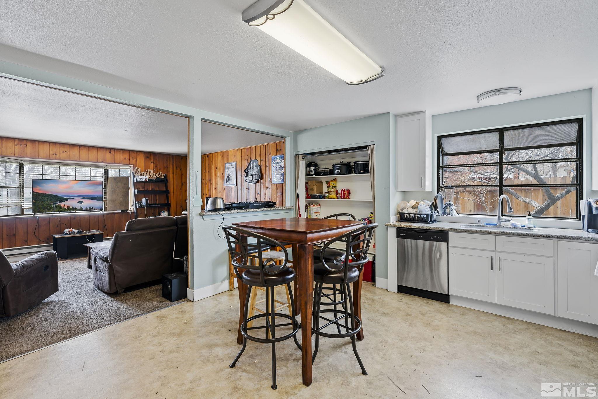 1001 Nevada Street Reno, NV 89503 - Photo 9 of 16 a kitchen with a table and chairs in it