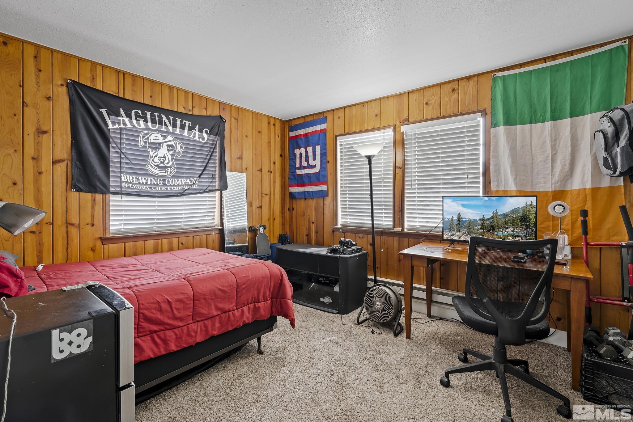 1001 Nevada Street Reno, NV 89503 - Photo 10 of 16 a bedroom with a bed and a window