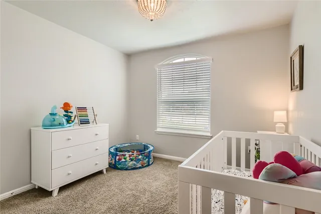 a view of kids room with toys and toys