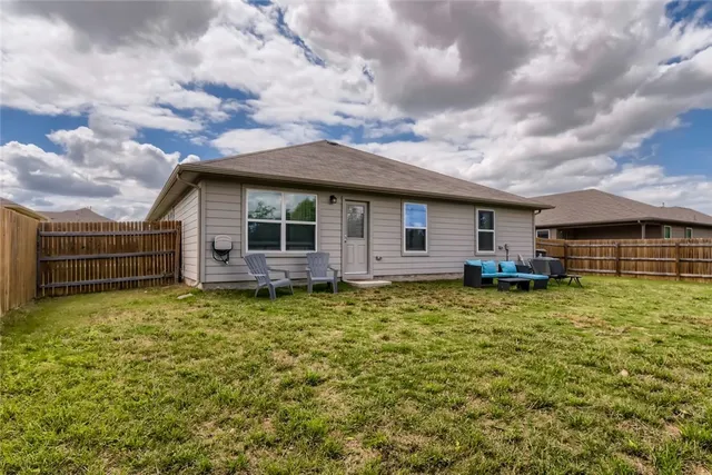 a backyard of a house with lots of green space