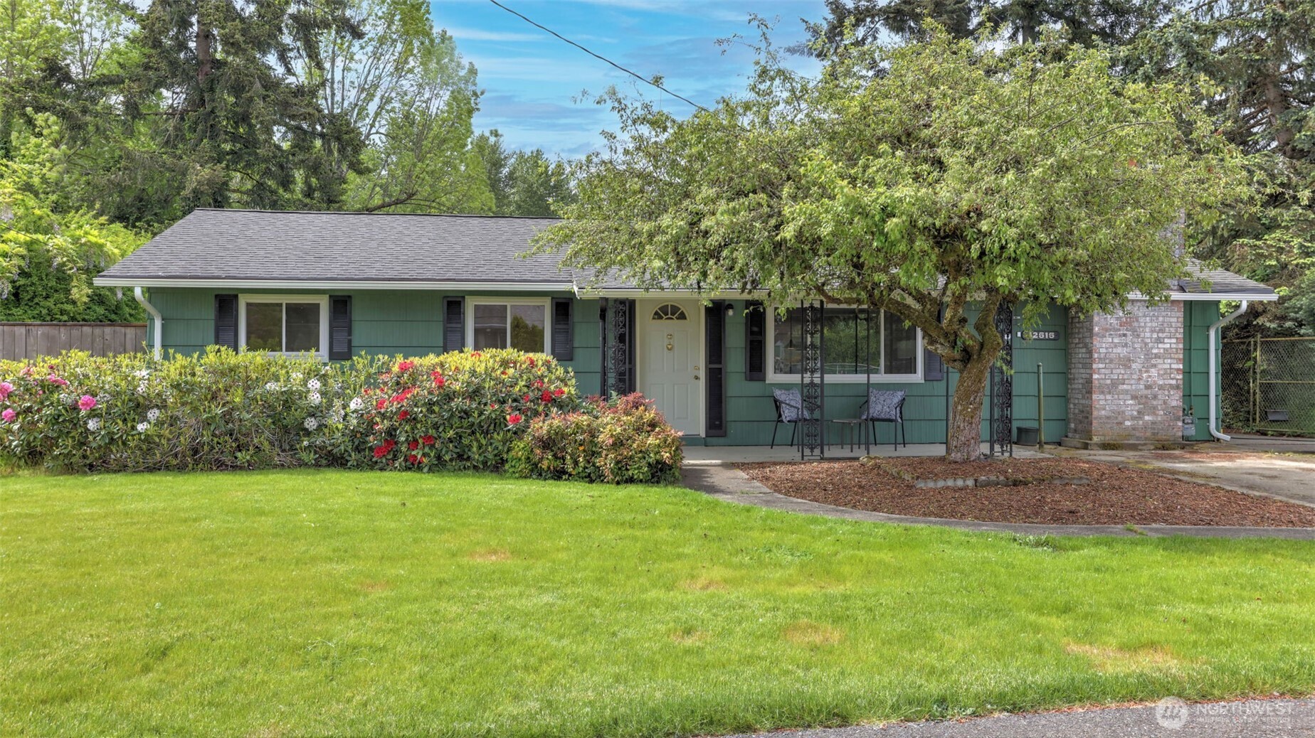 12515 Southeast 171st Street Renton, WA 98058 - Photo 2 of 24 a front view of house with yard and green space