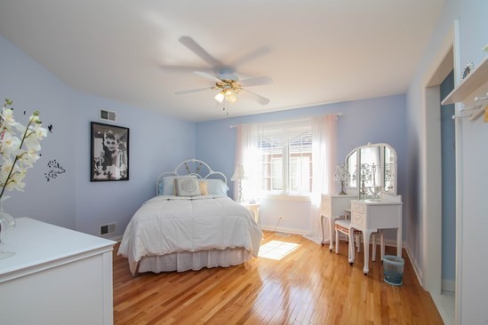 320 North County Line Road Hinsdale, IL 60521 - Photo 11 of 16 a bedroom with a bed and wooden floor