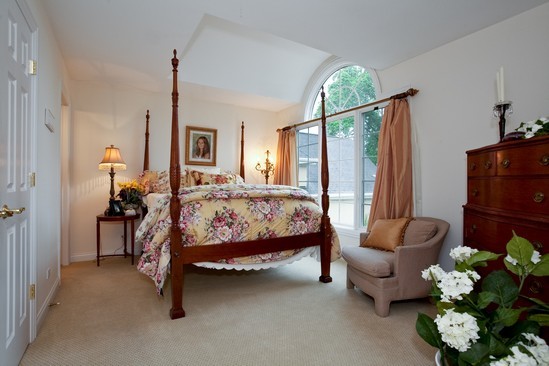 320 North County Line Road Hinsdale, IL 60521 - Photo 12 of 16 a bedroom with a bed mirror and a window