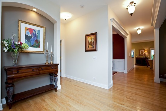 320 North County Line Road Hinsdale, IL 60521 - Photo 2 of 16 a view of a hallway with wooden floor and a potted plant