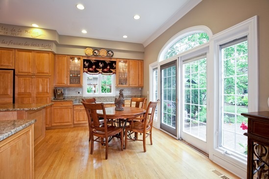 320 North County Line Road Hinsdale, IL 60521 - Photo 6 of 16 a dining room with furniture large windows and a chandelier