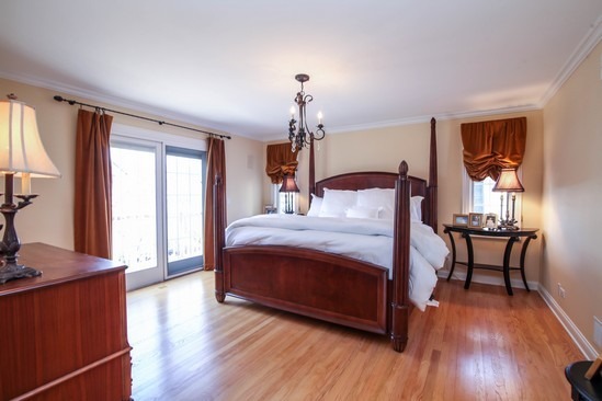 320 North County Line Road Hinsdale, IL 60521 - Photo 8 of 16 a bedroom with a bed and wooden floor