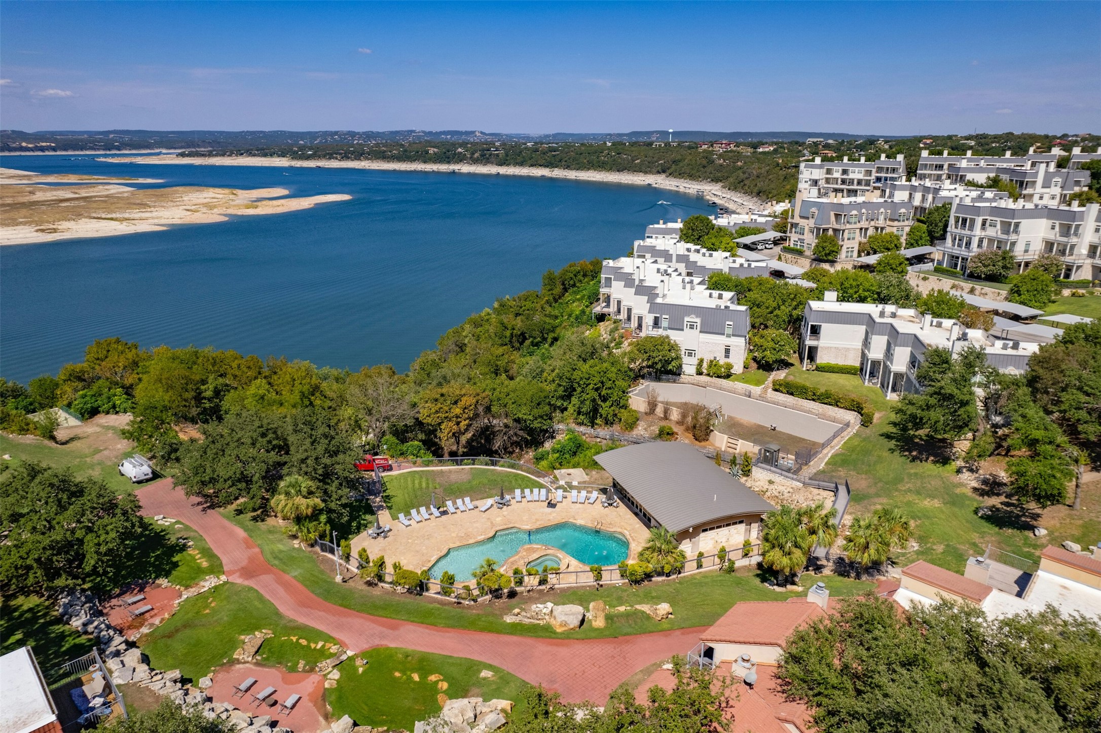 2918 Ranch To Market Road 620, Unit W219 Austin, TX 78734 - Photo 31 of 35 Aerial view of the lakefront community featuring resort-style amenities, lush landscaping, and unbeatable proximity to Lake Travis.