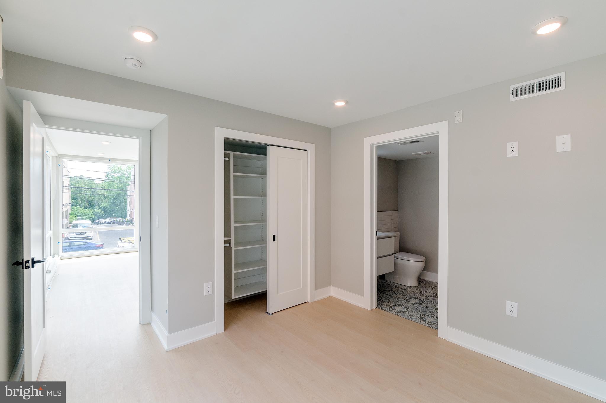 6604 Ridge Avenue, Unit 205 Philadelphia, PA 19128 - Photo 14 of 22 wooden floor and closet in a room