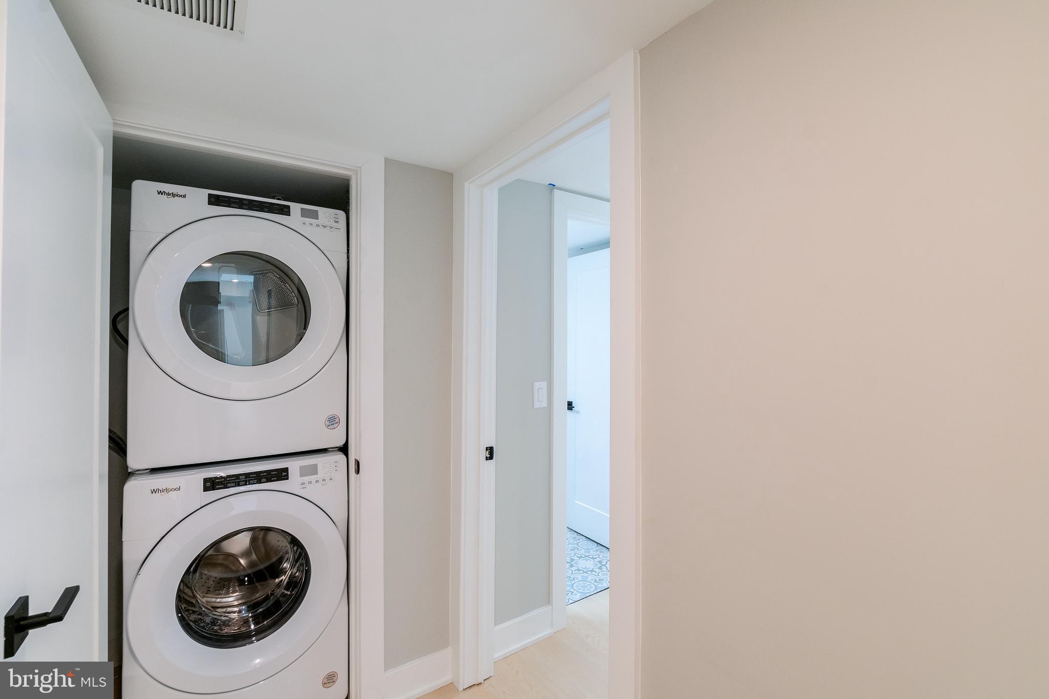 6604 Ridge Avenue, Unit 205 Philadelphia, PA 19128 - Photo 16 of 22 a utility room with dryer and washer