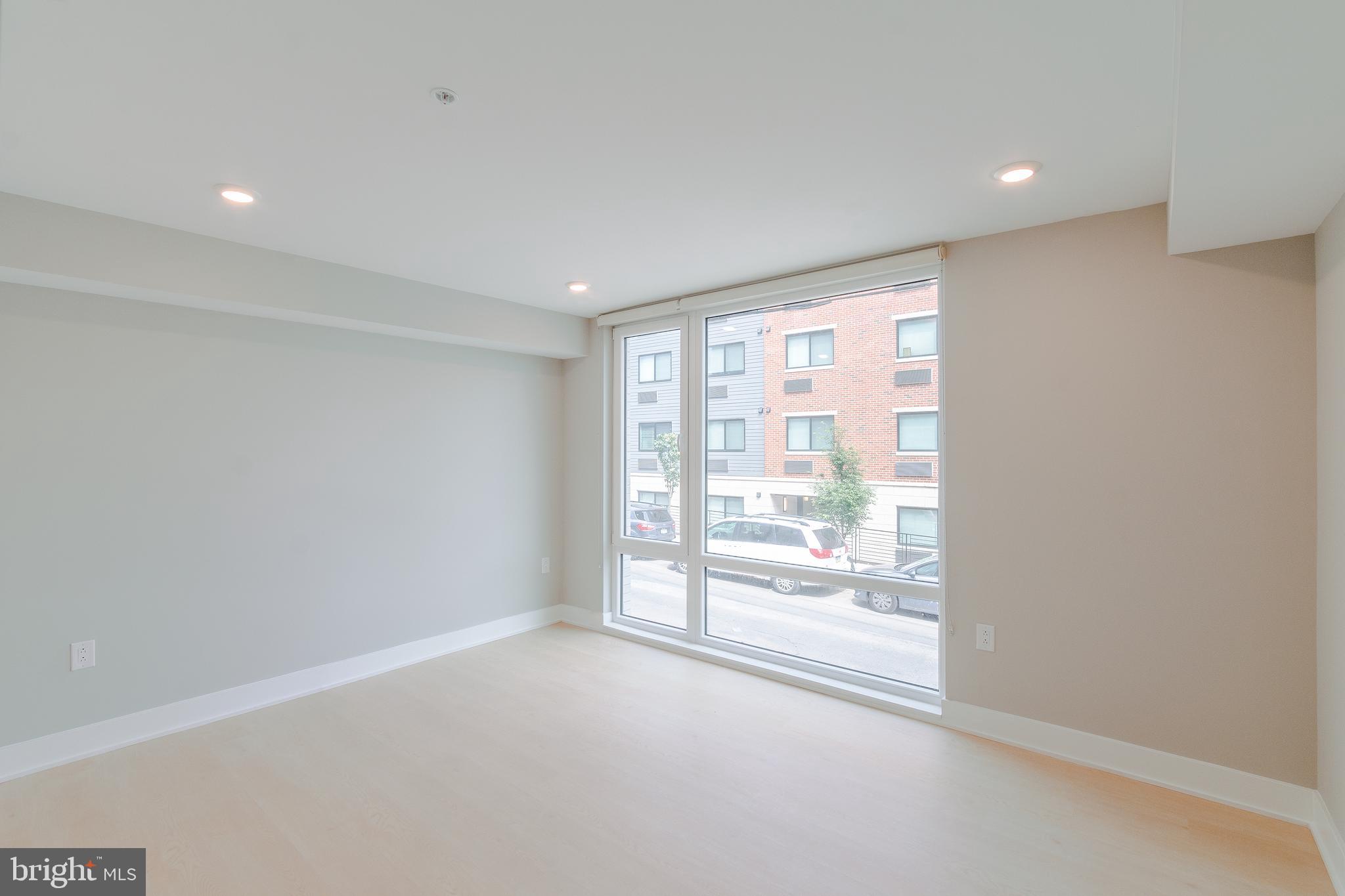 6604 Ridge Avenue, Unit 205 Philadelphia, PA 19128 - Photo 19 of 22 wooden floor in an empty room with a window