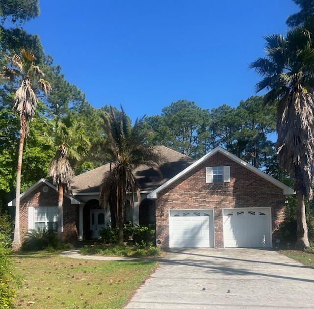 782 Driftwood Point Road Santa Rosa Beach, FL 32459 - Photo 1 of 33 a front view of a house with a yard