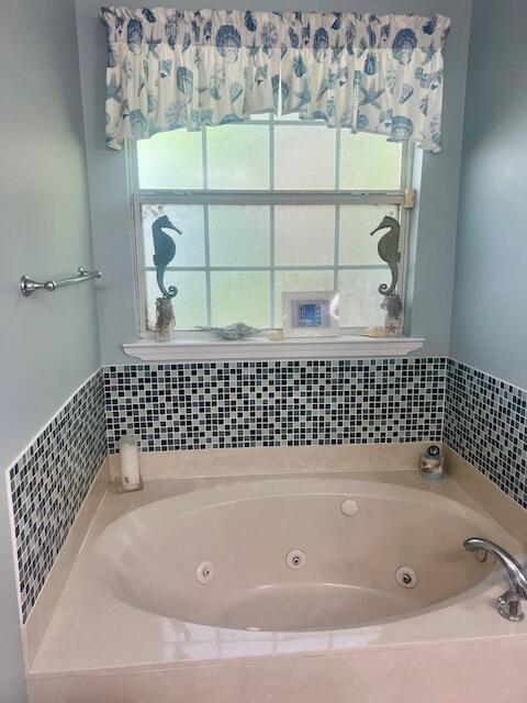 782 Driftwood Point Road Santa Rosa Beach, FL 32459 - Photo 14 of 33 a bathroom with a bathtub and shower