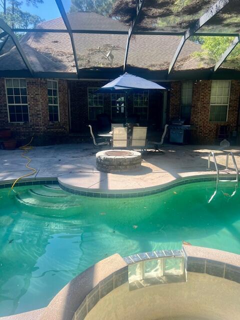 782 Driftwood Point Road Santa Rosa Beach, FL 32459 - Photo 26 of 33 a patio with a table and chairs