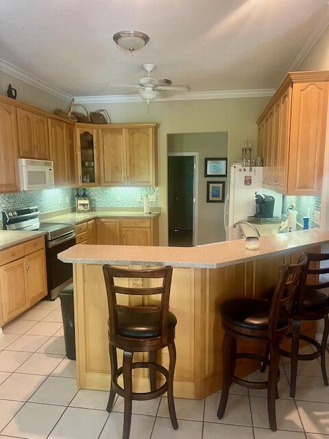 782 Driftwood Point Road Santa Rosa Beach, FL 32459 - Photo 7 of 33 a kitchen with a table chairs sink and cabinets