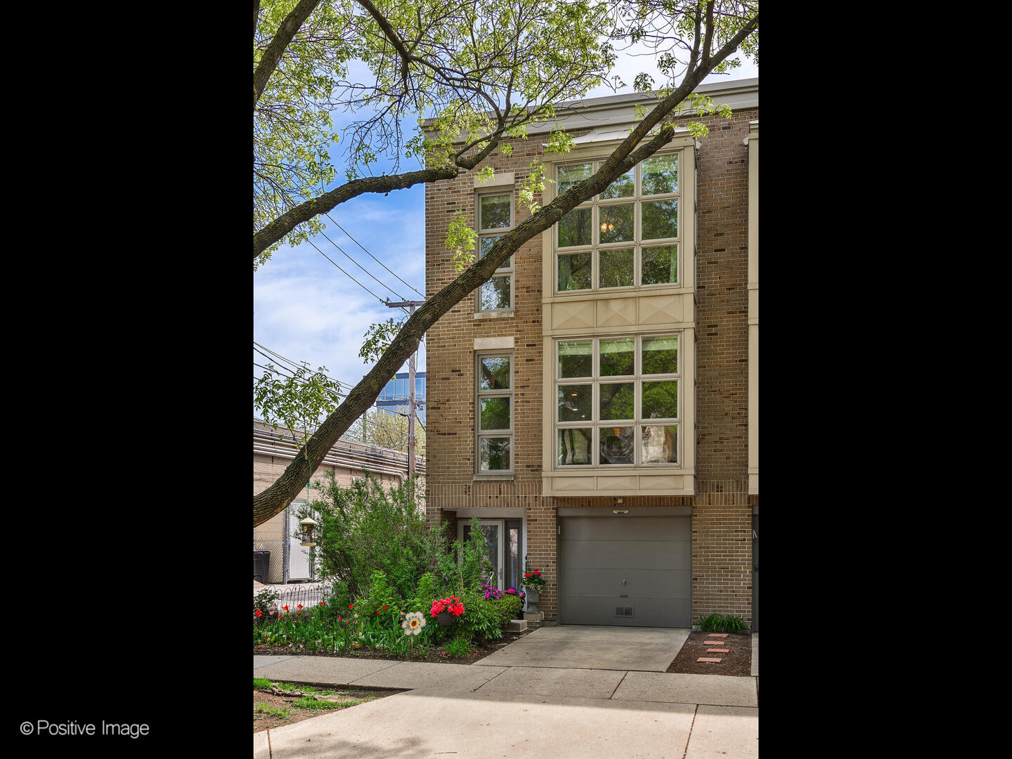 2393 North Wayne Avenue Chicago, IL 60614 - Photo 1 of 24 a view of a house with a yard and potted plants