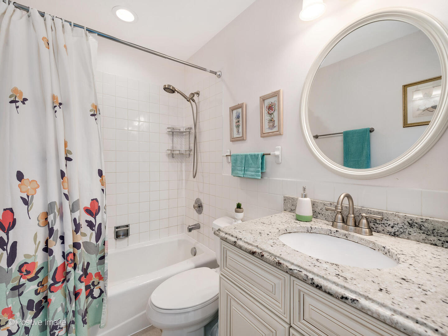 2393 North Wayne Avenue Chicago, IL 60614 - Photo 17 of 24 a bathroom with a granite countertop sink a mirror a vanity and a bathtub