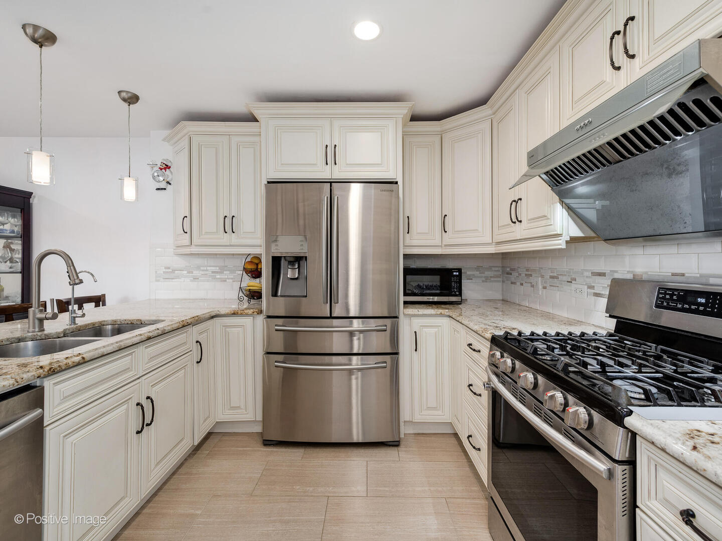 2393 North Wayne Avenue Chicago, IL 60614 - Photo 3 of 24 a kitchen with appliances a sink and a stove