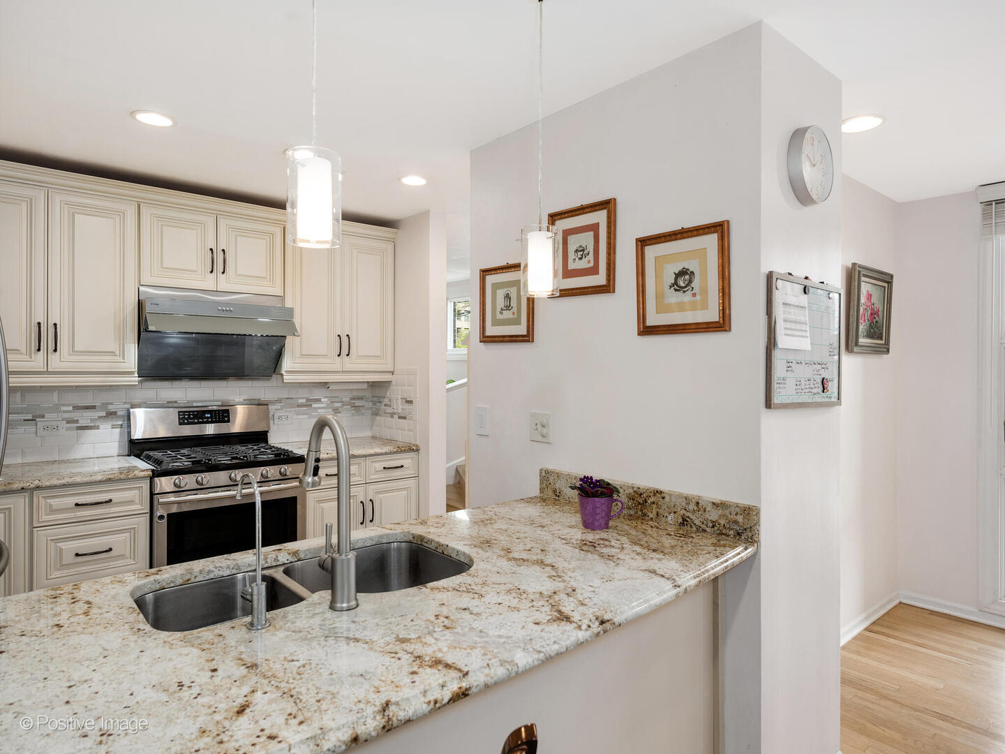 2393 North Wayne Avenue Chicago, IL 60614 - Photo 4 of 24 a kitchen with stainless steel appliances granite countertop a sink stove and refrigerator