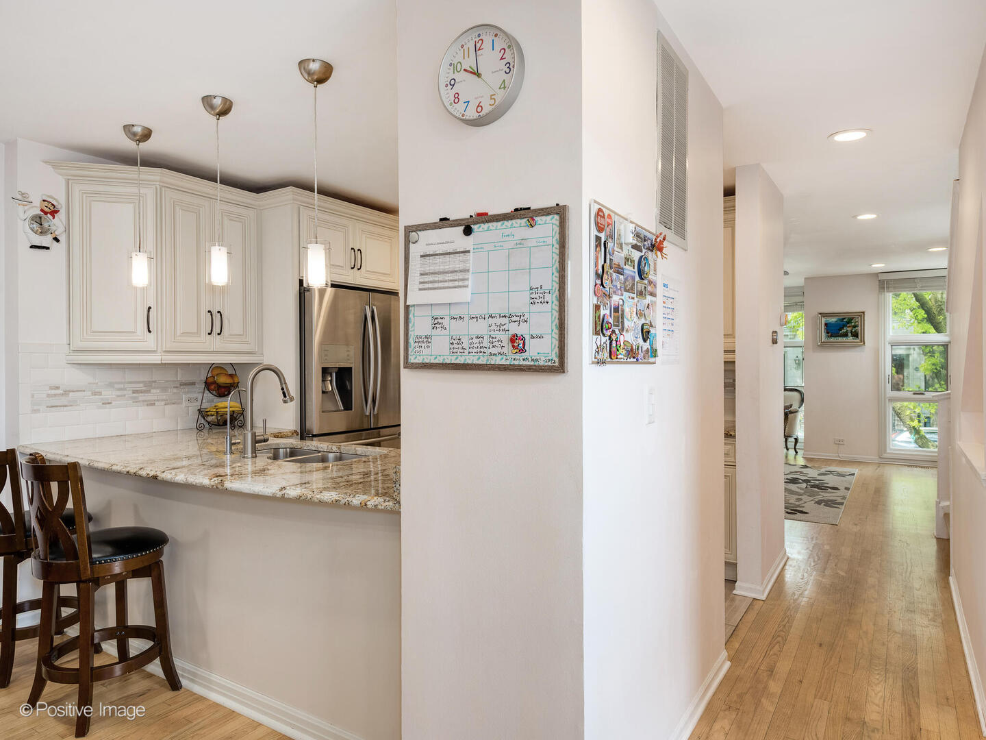 2393 North Wayne Avenue Chicago, IL 60614 - Photo 6 of 24 a kitchen with stainless steel appliances granite countertop a refrigerator and a sink