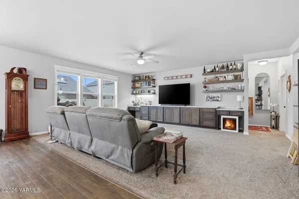 a kitchen with a sink cabinets and wooden floor