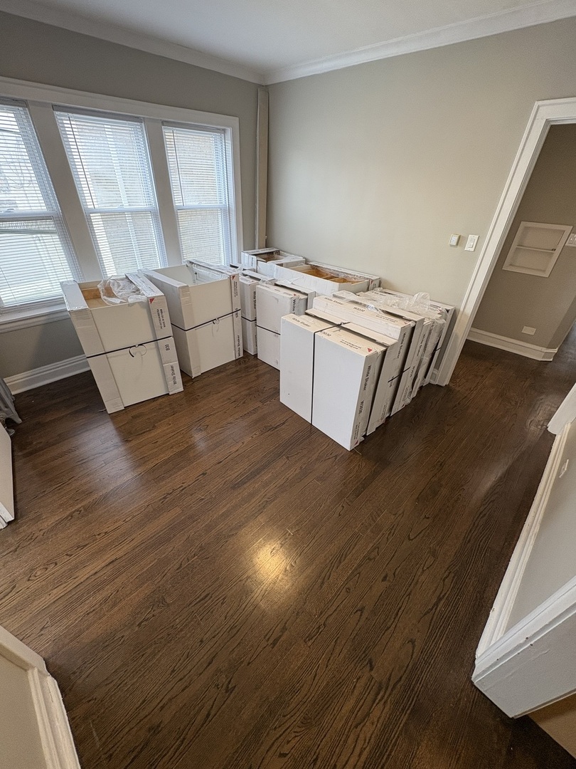 3245 Wisconsin Avenue, Unit 1S Berwyn, IL 60402 - Photo 6 of 10 a view of a kitchen with cabinets and wooden floor