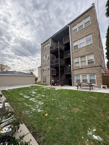 a view of a house with a garden