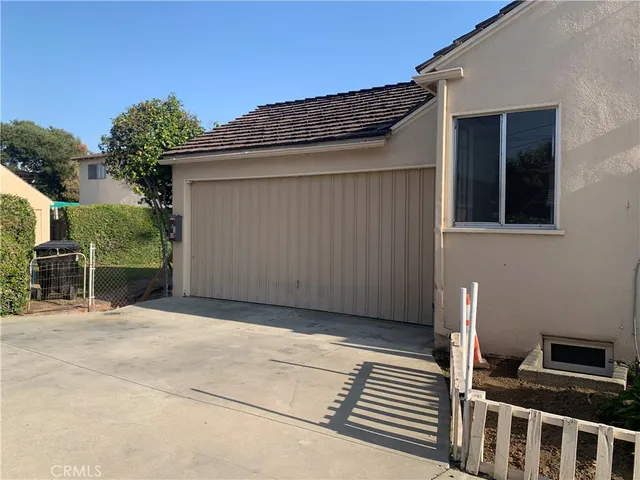 a view of backyard with garage