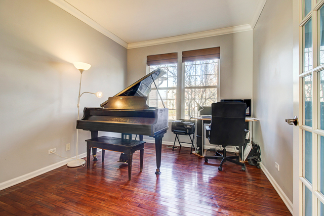 3 Firethorn Court Bolingbrook, IL 60490 - Photo 19 of 39 a view of a workspace with furniture and a window