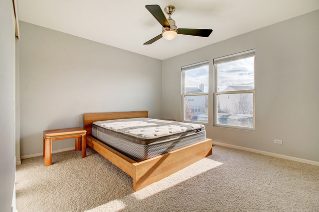 3 Firethorn Court Bolingbrook, IL 60490 - Photo 21 of 39 a room with a bed and a window
