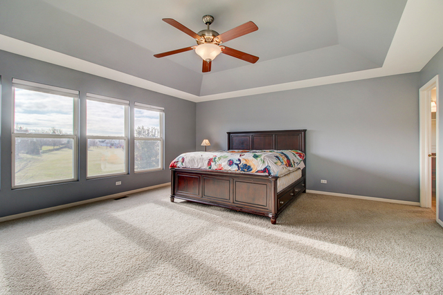 3 Firethorn Court Bolingbrook, IL 60490 - Photo 22 of 39 a bed room with a bed and a large window
