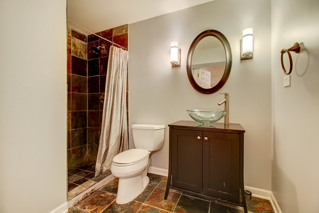 3 Firethorn Court Bolingbrook, IL 60490 - Photo 31 of 39 a bathroom with a toilet a sink and a mirror