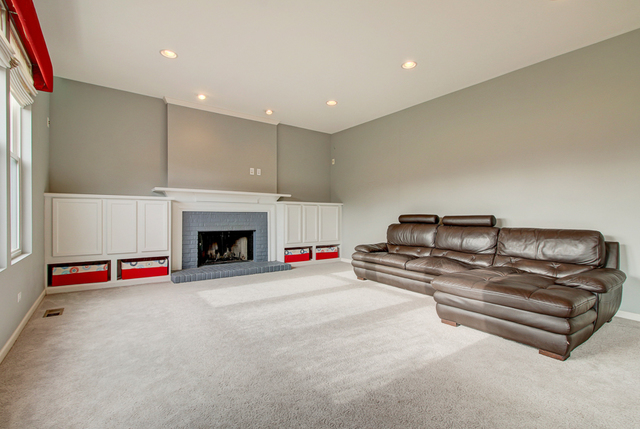 3 Firethorn Court Bolingbrook, IL 60490 - Photo 6 of 39 a living room with furniture and a fireplace