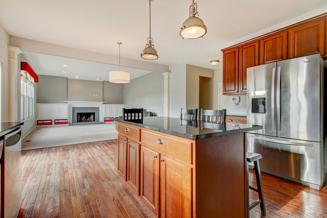 3 Firethorn Court Bolingbrook, IL 60490 - Photo 10 of 39 a kitchen with stainless steel appliances a refrigerator and a stove top oven