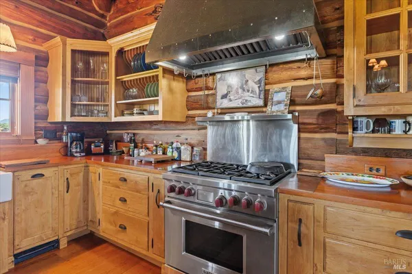 a kitchen with stainless steel appliances granite countertop a stove and a sink