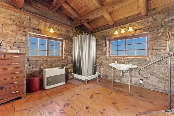 a view of a kitchen with a table and chairs