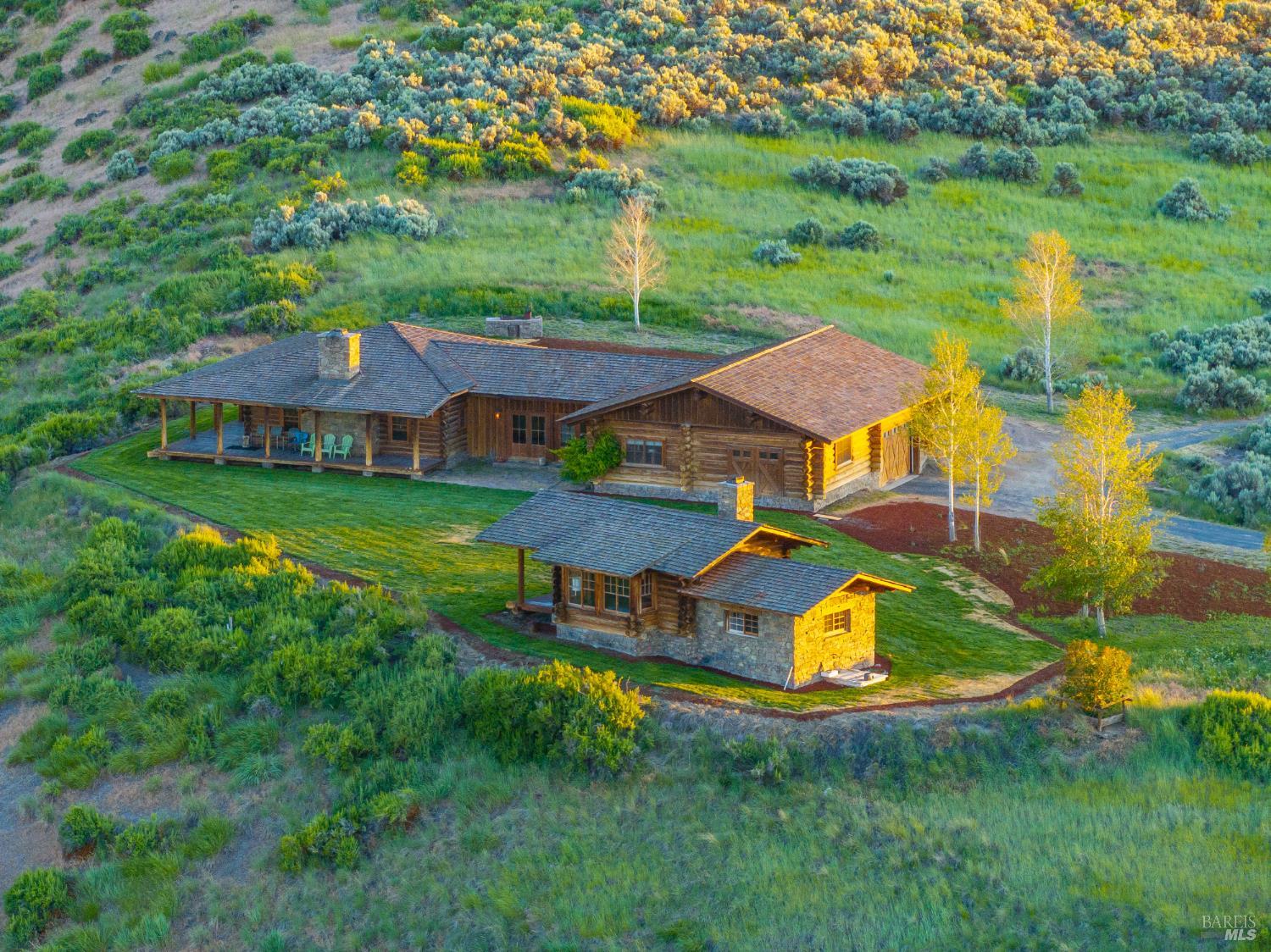 3034 State Line Road Klamath Falls, CA 97603 - Photo 6 of 42 an aerial view of a house with swimming pool garden and outdoor seating