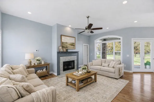 a living room with furniture and a fireplace