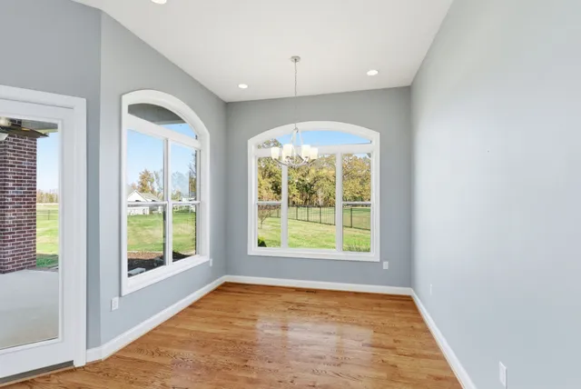 a view of kitchen with furniture and a fireplace