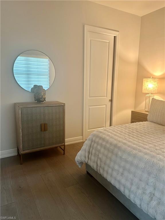 9179 Cayman Drive Naples, FL 34114 - Photo 19 of 50 a bedroom with a bed and cabinets