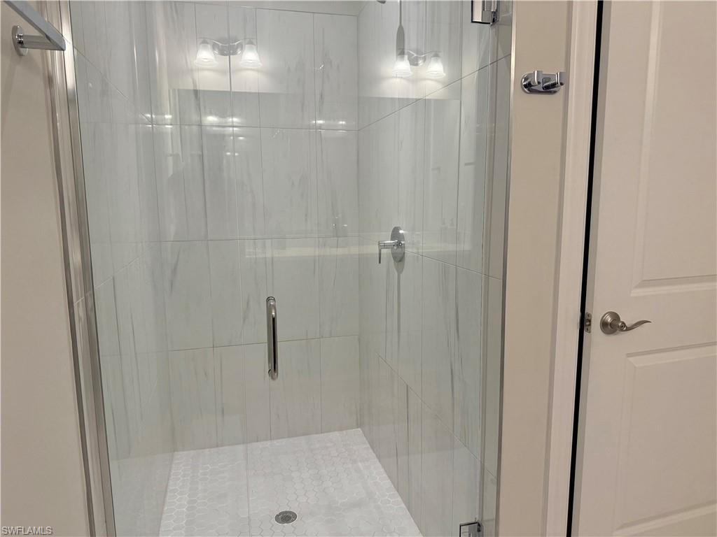 9179 Cayman Drive Naples, FL 34114 - Photo 21 of 50 a bathroom with a shower