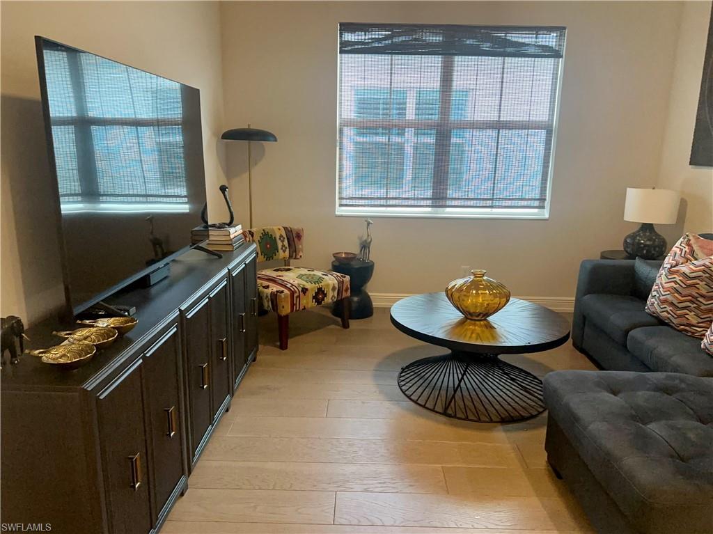 9179 Cayman Drive Naples, FL 34114 - Photo 26 of 50 a living room with furniture and a window