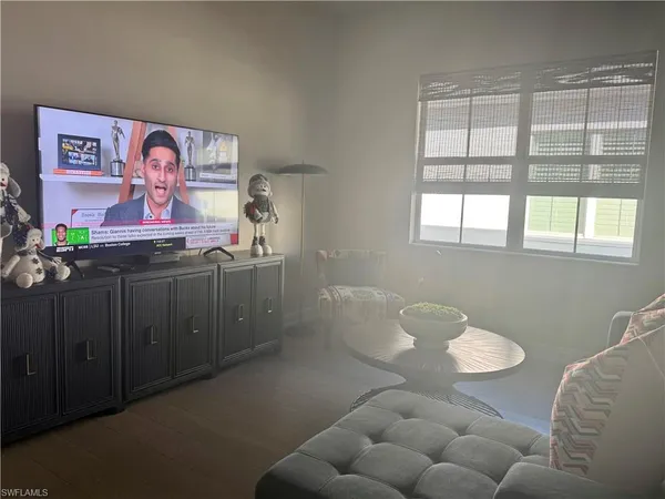 a view of a livingroom with furniture and a table