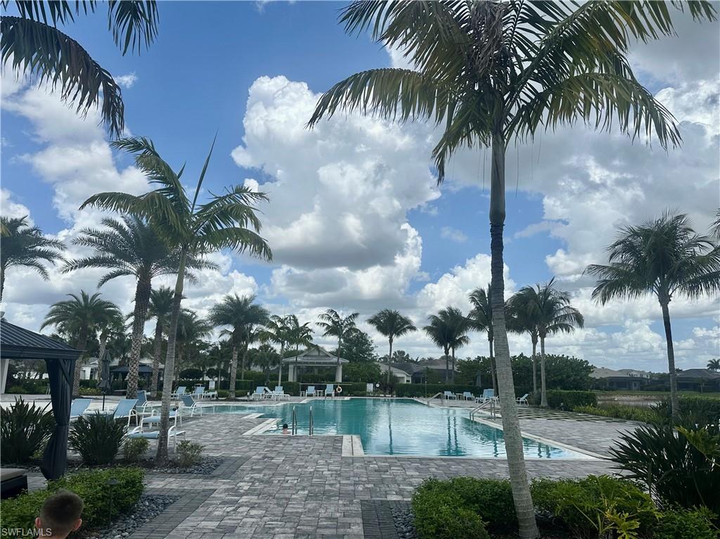 9179 Cayman Drive Naples, FL 34114 - Photo 36 of 50 a view of a yard and palm trees